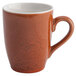 A brown Terra Verde Cotta coffee mug with a handle and speckled design.