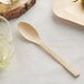 A Bamboo by EcoChoice compostable bamboo spoon on a table.