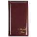 A burgundy leather Menu Solutions guest check presenter with a credit card pocket.