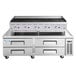 A Cooking Performance Group gas radiant charbroiler on a stainless steel chef base with drawers.