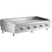 A Cooking Performance Group stainless steel gas countertop griddle with thermostatic controls and knobs.