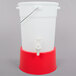 A white plastic beverage dispenser with a red base and lid.