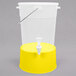 A translucent plastic beverage dispenser with a yellow base and lid.