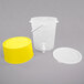 A translucent plastic container with a yellow base and a handle.