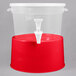 A translucent plastic beverage dispenser with a red base.
