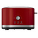 A red and silver KitchenAid 2-slice toaster with the KitchenAid logo.