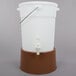 A white plastic water dispenser with a brown base.