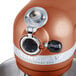 A KitchenAid Pro 600 series bowl lift countertop mixer in copper pearl.