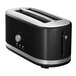 A black KitchenAid 4 slice toaster with silver accents.