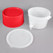 A white plastic container with a red lid and base.