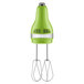 A KitchenAid green and silver hand mixer with stainless steel whisks.