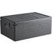 A black Cambro Cam GoBox top loading food pan carrier with a lid.