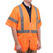 A man wearing a Cordova orange high visibility safety vest with reflective stripes.