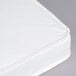 A white L.A. Baby crib mattress with a stitched edge.