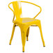 A yellow Flash Furniture metal chair with arms and a slatted back.