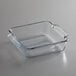 An Anchor Hocking clear glass square baking dish with handles.