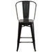 A Flash Furniture black metal counter height stool with a black vertical slat back.