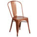 A Flash Furniture brown metal chair with a vertical slat back and drain hole seat.