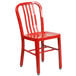 A red metal chair with a vertical slat back on a white background.