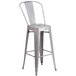 A Flash Furniture silver galvanized steel bar stool with a vertical slat back.