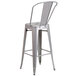 A Flash Furniture silver galvanized steel bar height stool with a vertical slat back.
