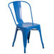 A blue Flash Furniture metal chair with a vertical slat back and drain hole seat.