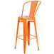 An orange Flash Furniture bar height stool with a vertical slat back.