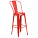 A red metal Flash Furniture bar height stool with a seat.
