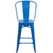 A blue galvanized steel bar stool with a vertical slat back.