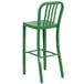 A green Flash Furniture metal bar stool with a backrest.
