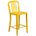 A yellow Flash Furniture metal counter height stool with vertical slat back.