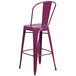 A purple Flash Furniture bar stool with a vertical slat back and drain hole seat.