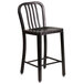 A Flash Furniture black metal counter height stool with a black metal and wood slat back.