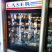 A store front with a Curtron display cooler strip curtain over the door.