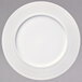A white Oneida porcelain plate with a thin circular rim.