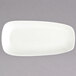 A Oneida warm white porcelain rectangular platter with a small rim.