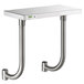 A Regency stainless steel adjustable work surface on a metal shelf with two metal pipes.