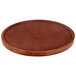A round wooden table top with a mahogany finish.