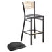 A Lancaster Table & Seating black bistro bar stool seat with a natural wood back and black pad.