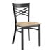 A Lancaster Table & Seating black metal cross back chair with a driftwood seat.