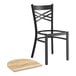 A Lancaster Table & Seating black cross back chair with a driftwood seat.