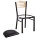 A Lancaster Table & Seating black bistro chair seat with black vinyl cushion on a white background.