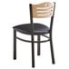 A Lancaster Table & Seating black and natural wood bistro chair with a black seat.