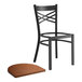 A Lancaster Table & Seating black cross back chair with a wooden seat.