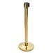 A gold Lancaster Table & Seating crowd control stanchion pole.