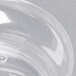 A close-up of a clear Fineline Savvi Serve plastic bowl with a swirl design.