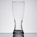 An Anchor Hocking Rim Tempered Pilsner Glass with a clear surface and a shadow.