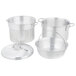 A Vollrath Wear-Ever pasta cooker set with a silver pot, lid, and colander.