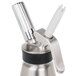 A stainless steel iSi decorator tip with white details.