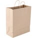 A close-up of a brown Duro paper shopping bag with brown handles.